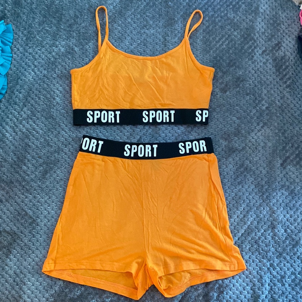 Orange sport set size small.